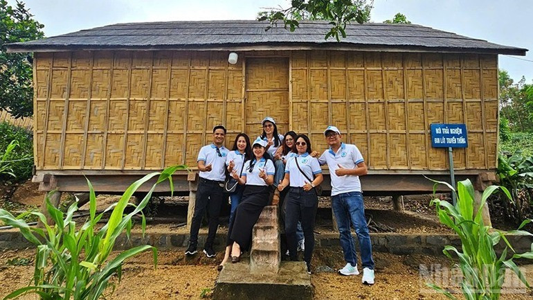 Visitors take photos with the restored stilt house in the revolutionary village of Stor. Visitors take photos with the restored stilt house in the revolutionary village of Stor.