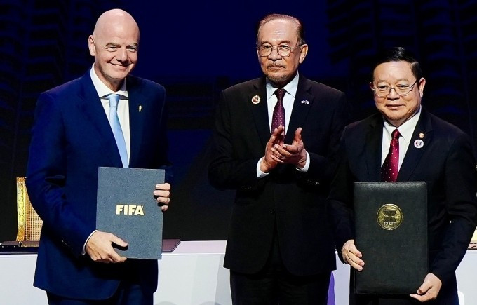 FIFA president Gianni Infantino (L) signs the FIFA ASEAN Cup agreement with ASEAN secretary general Kao Kim Hourn (R) in the presence of Malaysian prime minister Anwar Ibrahim, the 2025 ASEAN chairman. Photo by FIFA FIFA president Gianni Infantino (L) signs the FIFA ASEAN Cup agreement with ASEAN secretary general Kao Kim Hourn (R) in the presence of Malaysian prime minister Anwar Ibrahim, the 2025 ASEAN chairman. Photo by FIFA