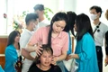 Pink Hair Gia Lai Club donates 220 wigs to cancer patients