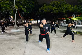 Martial arts master Nguyễn Minh Giang teaches traditional martial arts to students at Nhon Binh Secondary School. Photo: M.N