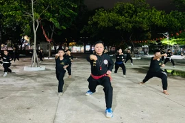 Martial arts master Nguyễn Minh Giang teaches traditional martial arts to students at Nhon Binh Secondary School. Photo: M.N