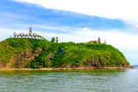 The Trần Hưng Đạo monument and the Phước Mai lighthouse are located atop a mountain at the mouth of Quy Nhơn Bay.Trần Quốc Tuấn, Ganh Ho Hill, Thị Nại Lagoon, Vietnamese patriotism