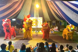 Children at SOS Children's Village Pleiku attentively watched the lion dance performance.