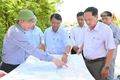 Chairman of the Provincial People's Committee Pham Anh Tuan inspects locations designated for the development of several projects in An Lao commune.