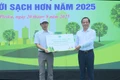 Standing Vice Chairman of the Provincial People's Committee Nguyễn Tuấn Thanh (right) presents a symbolic plaque for the donation of trees to a representative of the Department of Culture, Sports and Tourism.
