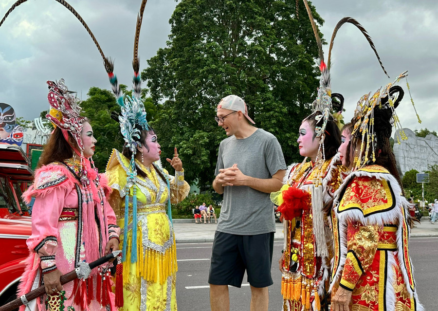 Ms. Nguyễn Hằng (second from left) introduces tuồng art to visitors. Photo: Thảo Khuy 19.jpg