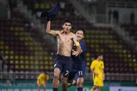 Kakana Khamyok takes off his shirt to celebrate Thailand's late goal in the U23 Asian Cup qualifier against Malaysia on Sept. 9, 2025. Photo by FAT