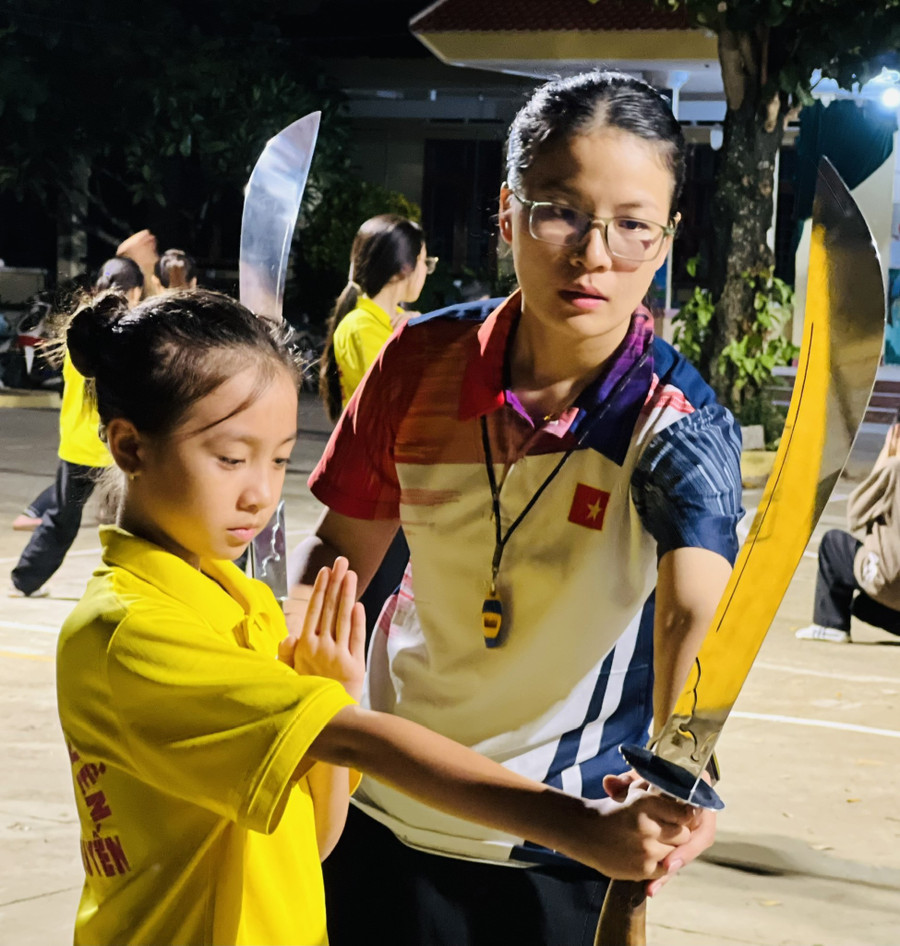 Ms. Phạm Thị Hằng instructing students in martial arts training. Photo: M.N pham-thi-hang.jpg