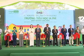 Delegates cut the ribbon at the inauguration of the Yăng Village School, funded by the Cargill Cares Foundation. Photo: R'Piên