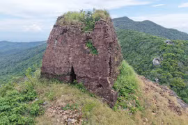 A Close-Up Look at the Solitary Cham Tower Atop Hon Chuong Peak