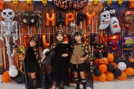 Children excitedly dress up in costumes and take photos at the Halloween Festival.