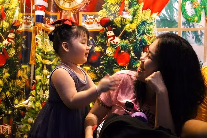 Children taking photos with their families.