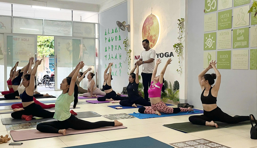 Many women choose to practice yoga every early morning at Nataraj Yoga Quy Nhon Center. Photo: Ho Diem 2a.jpg