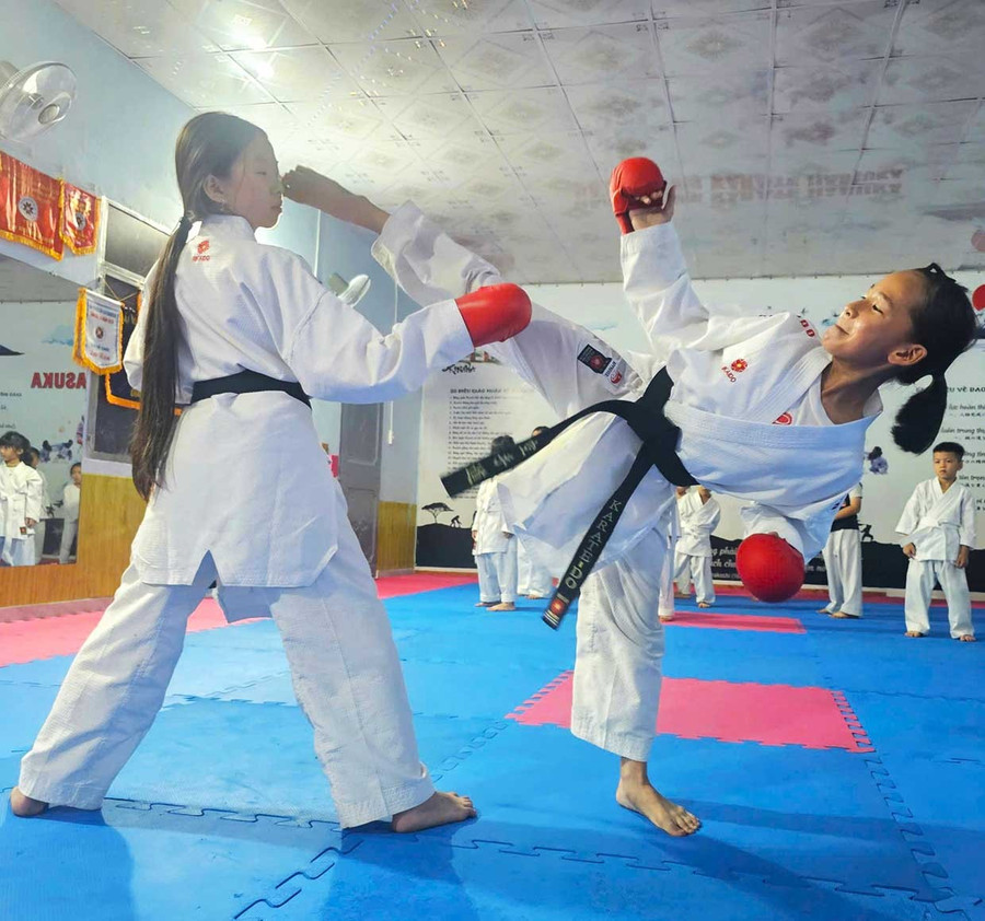 Lữ Thị Gia Hân (right) is a standout member of the Hasuka Karate Club.